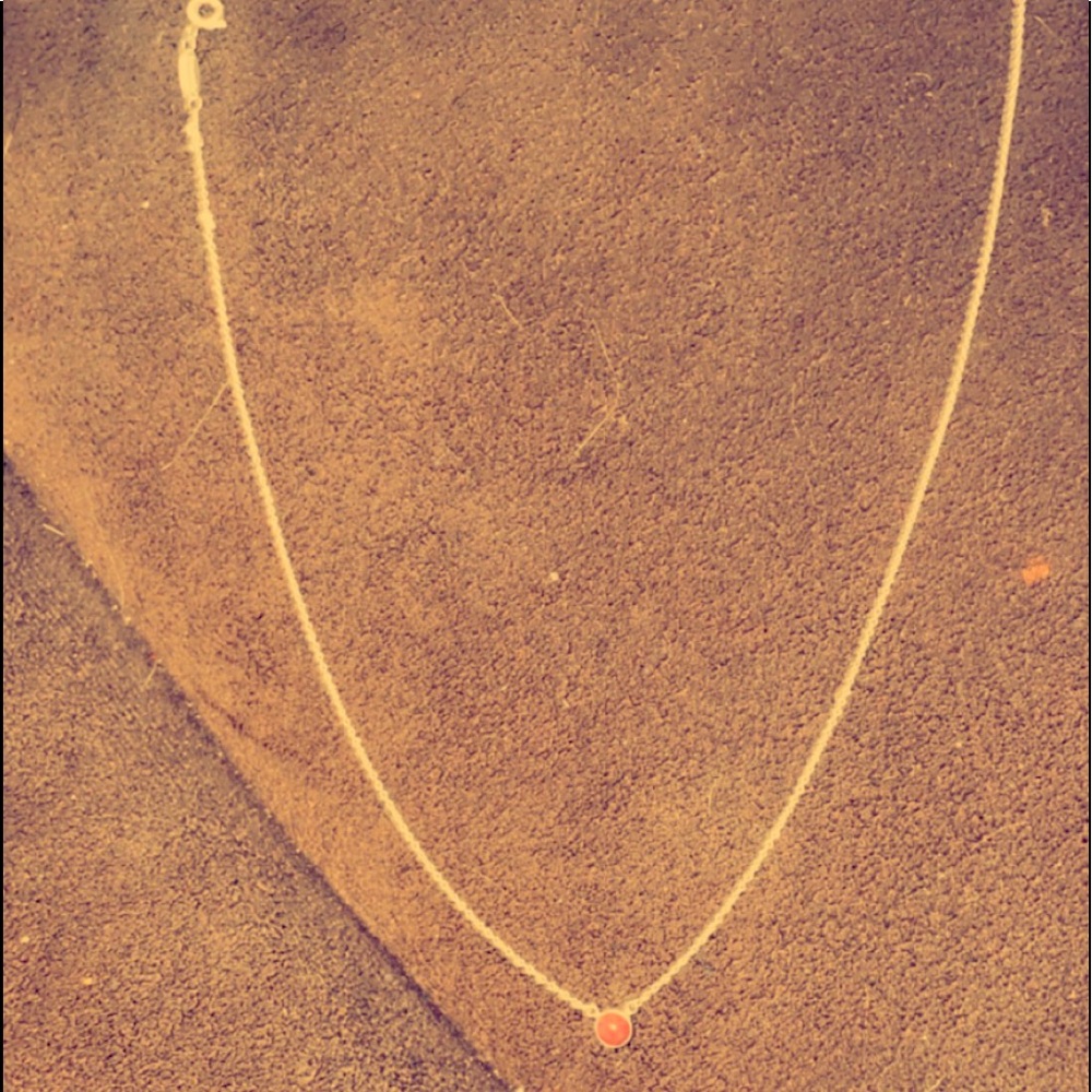 Only worn twice and from Tiffany’s. It’s white gold with an opal pendant.